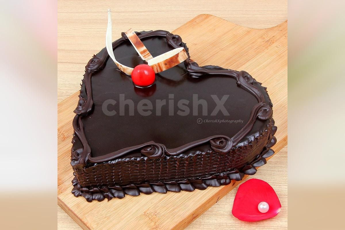Pink roses with a heart shape chocolate truffle cake by cherishx