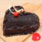 Pink roses with a heart shape chocolate truffle cake by cherishx