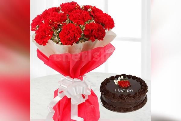 Red carnations with chocolate truffle cake