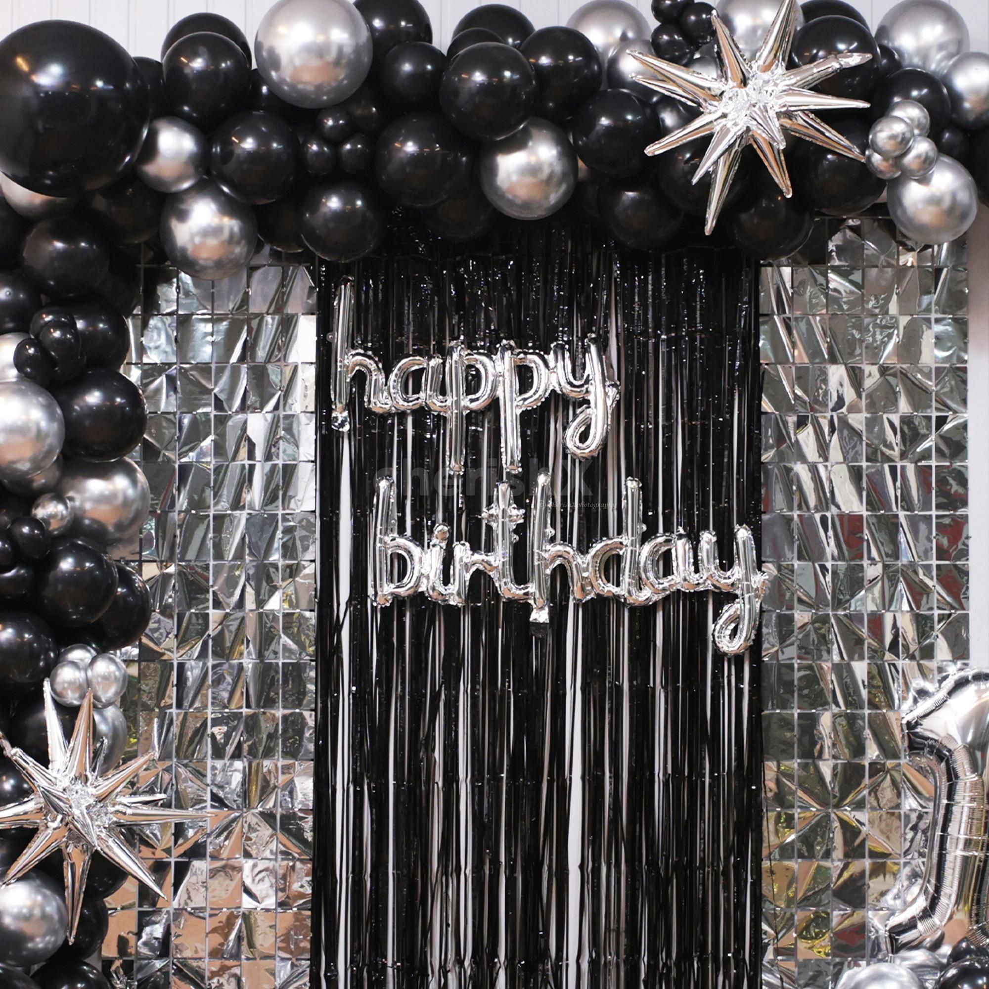Free-floating balloons and the age digit foil balloons mix shapes and styles for Birthday