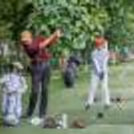 A man in his late 60s enjoying Golf.