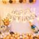 Balloon room decoration for a birthday with a silver theme.