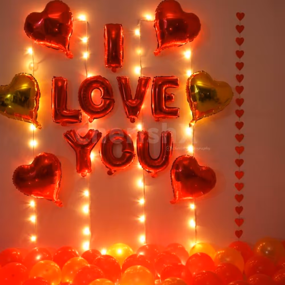 Romantic Balloon Decoration with I LOVE YOU foil balloons, heart shaped foil balloons and fairy lights