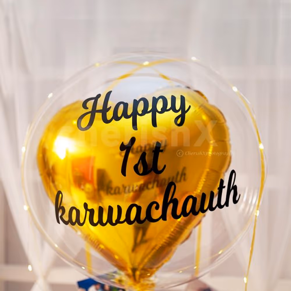 A Bubble Balloon with a Golden Heart-shaped foil balloon.
