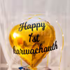 A Bubble Balloon with a Golden Heart-shaped foil balloon.