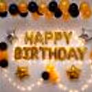 An amazing Golden and Black themed room decor for a Birthday Celebration.