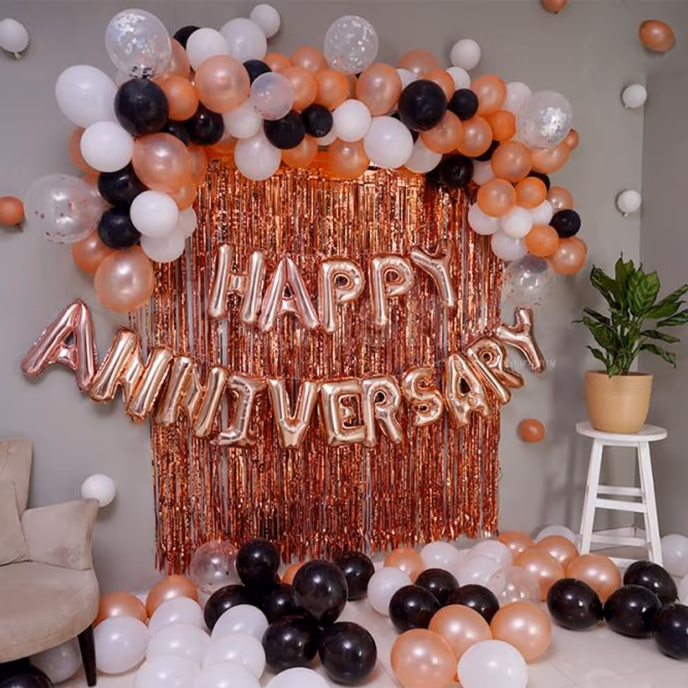 The Decor is filled with Rosegold, White and Black Balloons.