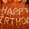 Rose Gold Happy Birthday Foil Balloons to enhance the room decor.