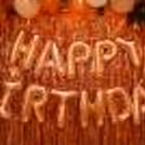 Rose Gold Happy Birthday Foil Balloons to enhance the room decor.