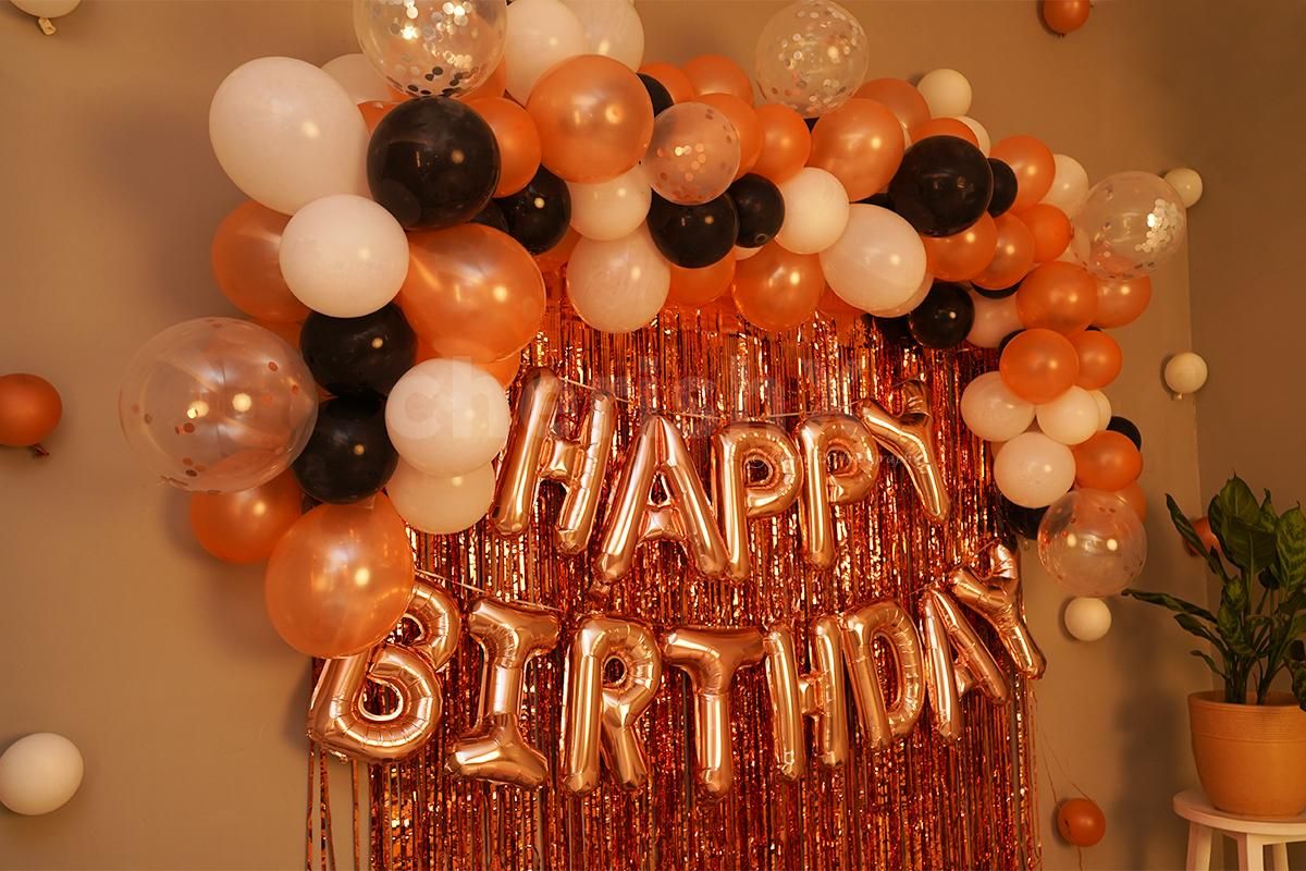Rosegold Frill Curtains and Black, White Balloons add an elegant look to the decor.