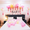 A gentle curve of pastel balloons creates a whimsical atmosphere for the welcome room.
