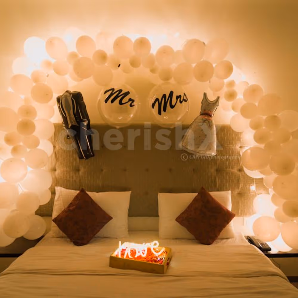 Celebrate your first night by surprising your partner with beautiful white theme decor offered by CherishX!!
