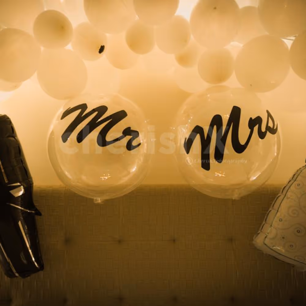 Mr and Mrs Foil Balloons and 2 bubble Balloons with Vinyl Print to enhance the whole outlook of the decor.