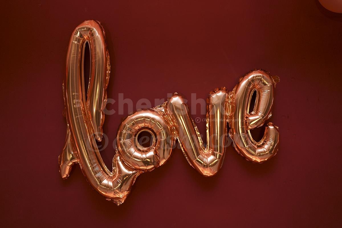 cursive love balloon in rosegold color