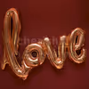 cursive love balloon in rosegold color