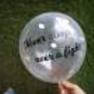 A helium confetti balloon with a 'never sleep over a fight' vinyl message.