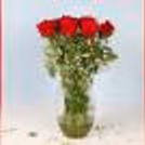 Gorgeous 12 red roses in glass vase delivered fresh to surprise your loved one.