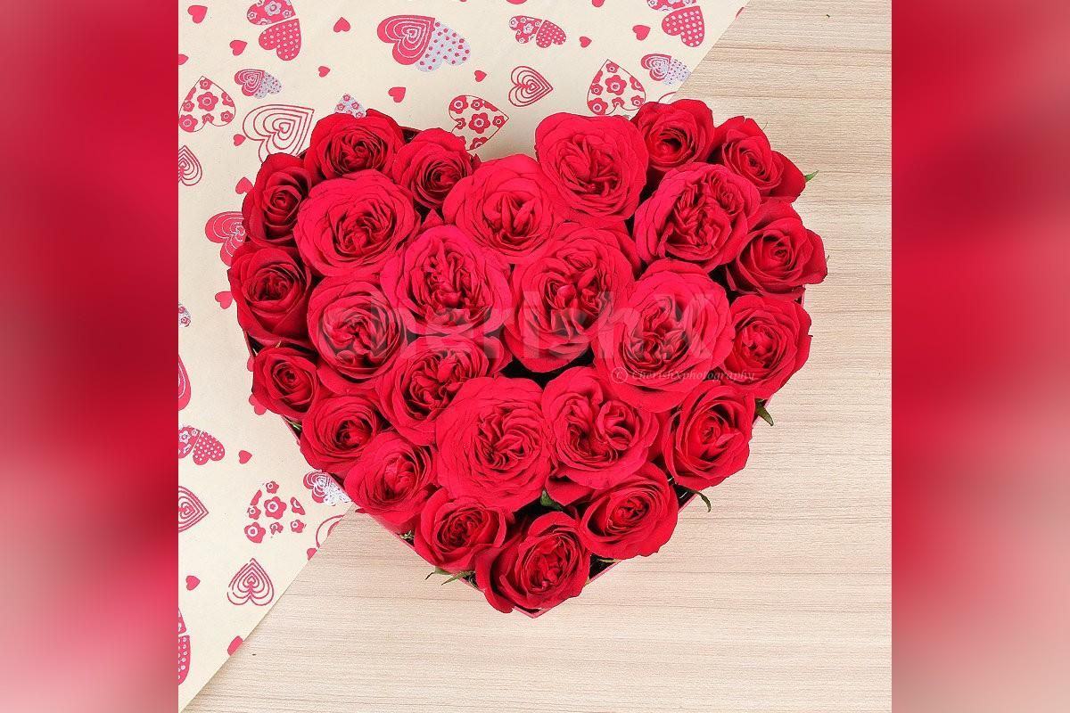 25 Red Rose arrangement in the shape of a heart.