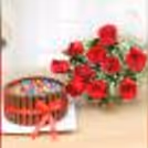 A combo of red roses and Kitkat gems cake.
