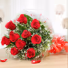 A bouquet of red roses packed with a cellophane sheet.