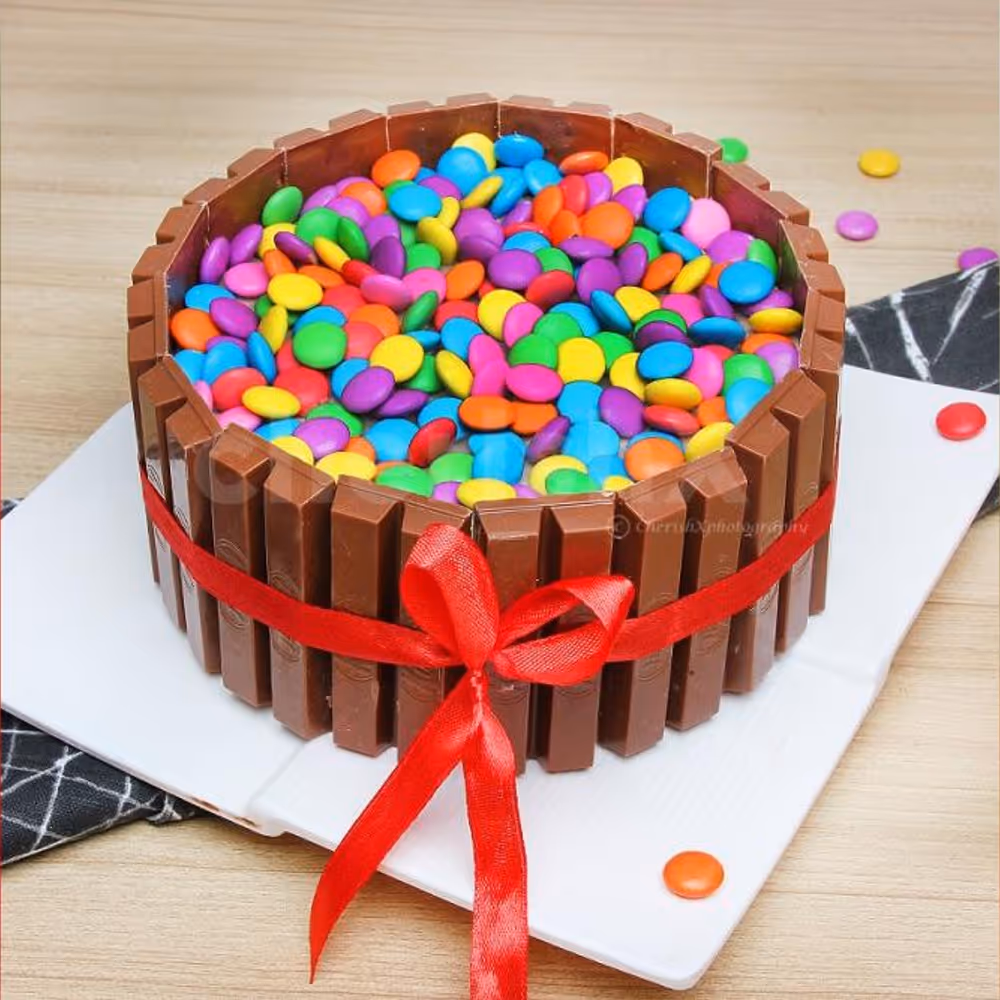 KitKat Gems delicious cake to go with the flowers.