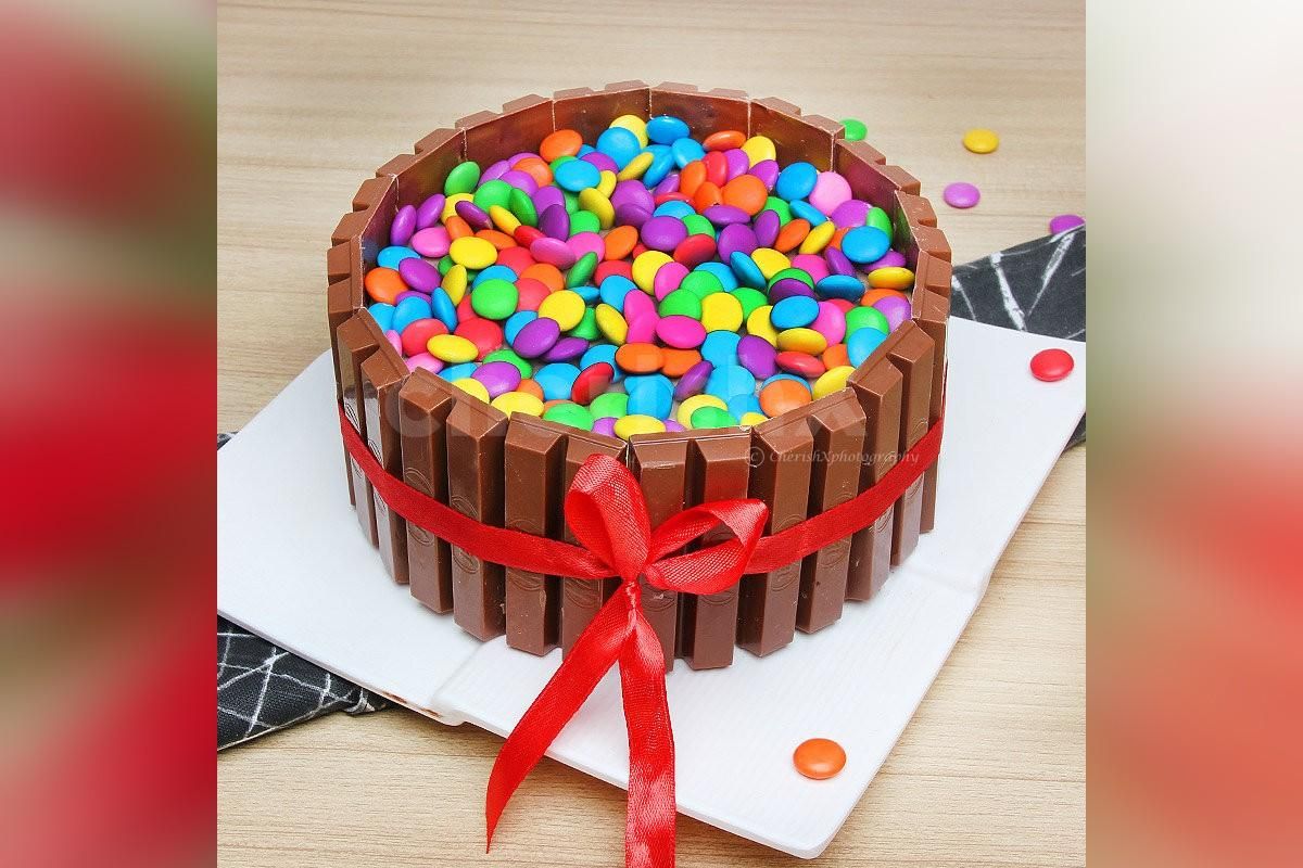 KitKat Gems delicious cake to go with the flowers.