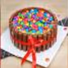 KitKat Gems delicious cake to go with the flowers.