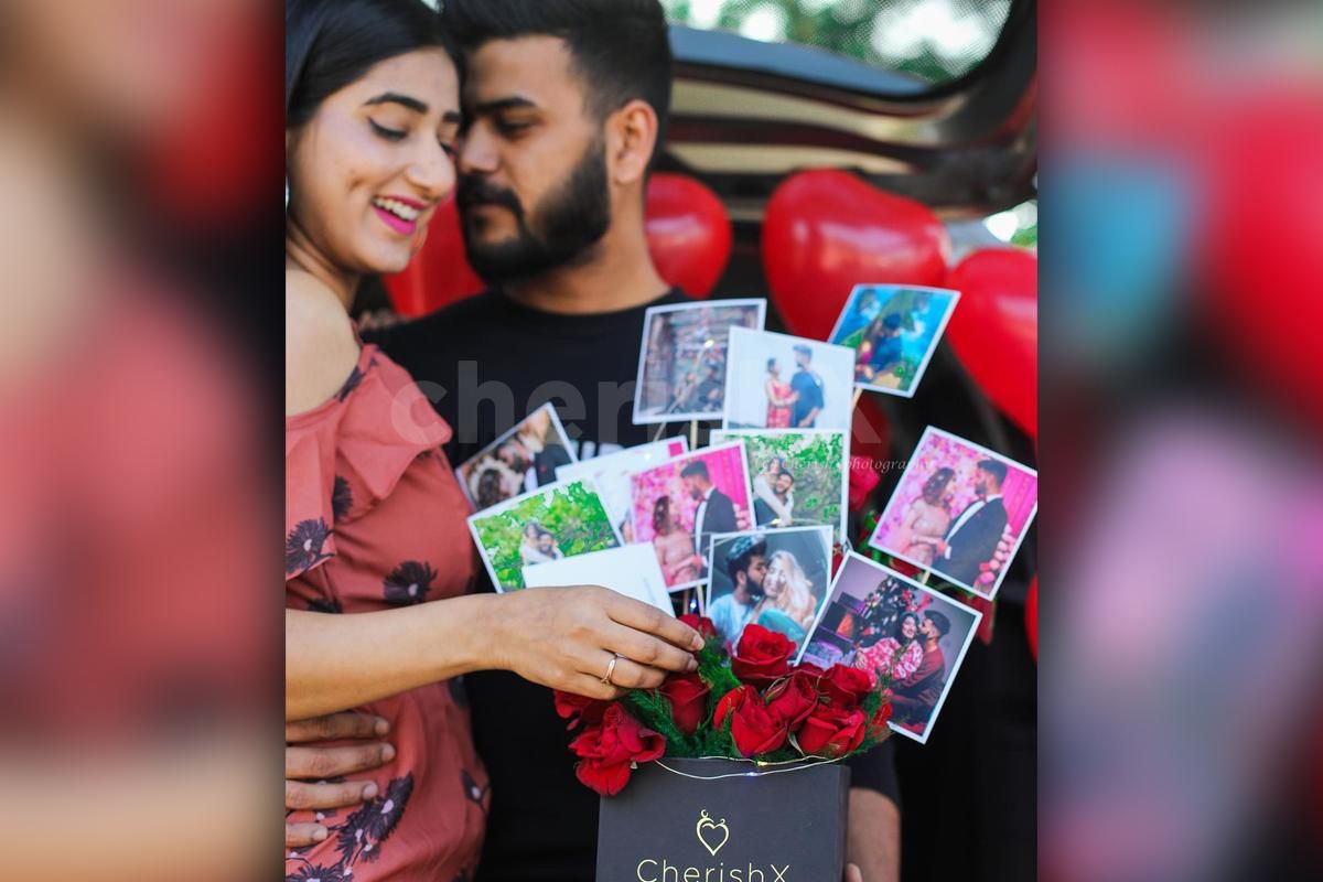 A couple with CherishX's rose bucket.
