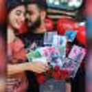 A couple with CherishX's rose bucket.