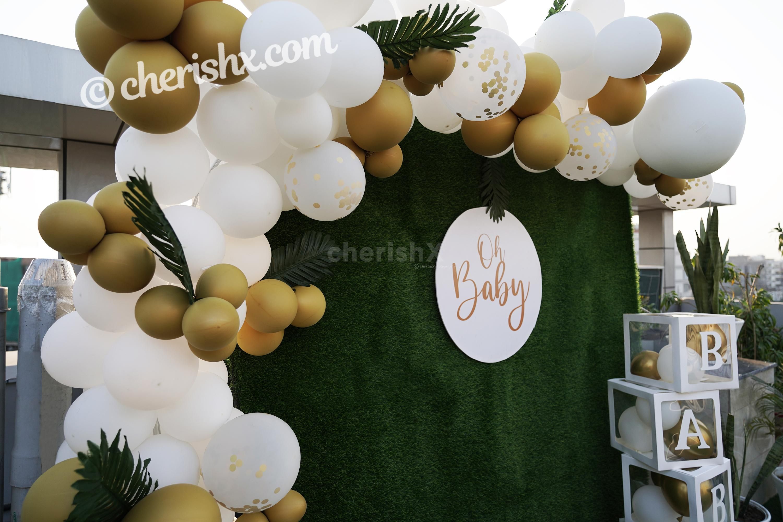 CherishX's Golden and White Baby Shower Decor lets you have a grand celebration. So, book this lovely decor to make your celebrations lovely!