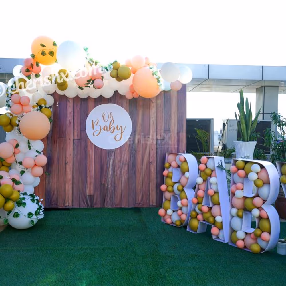 Celebrate the birth of your child joyously by booking CherishX's Peach Colored Baby Shower Decor!