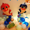 The Baby Shark Themed Room Decoration includes circle baby shark foil balloons.