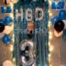 The Boss Baby Surprise Decor consists of 'HBD' Foil balloons as well as a Boss Baby cut-out for the wall.