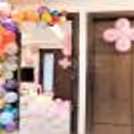 CherishX's Welcome Baby Girl Decor in a room with bunches of pink colour balloons.