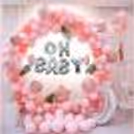A beautifully curated baby shower decor in shades of pink.
