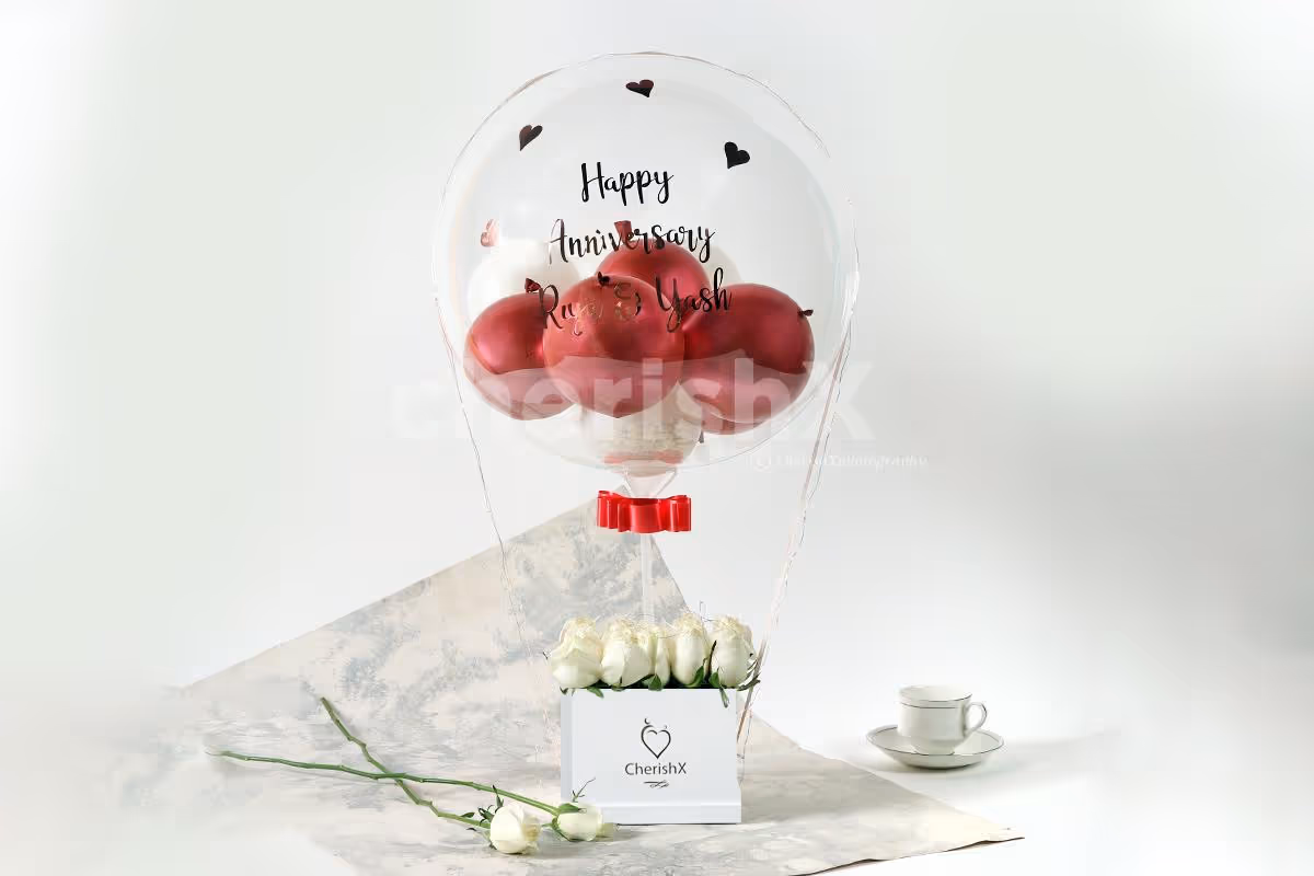 Rosegold Balloon bucket with white roses delivery in Bangalore