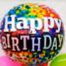 A Vibrant Happy Birthday Foil Balloon.