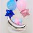Baby shower balloon bouquet with blue and pink balloons.