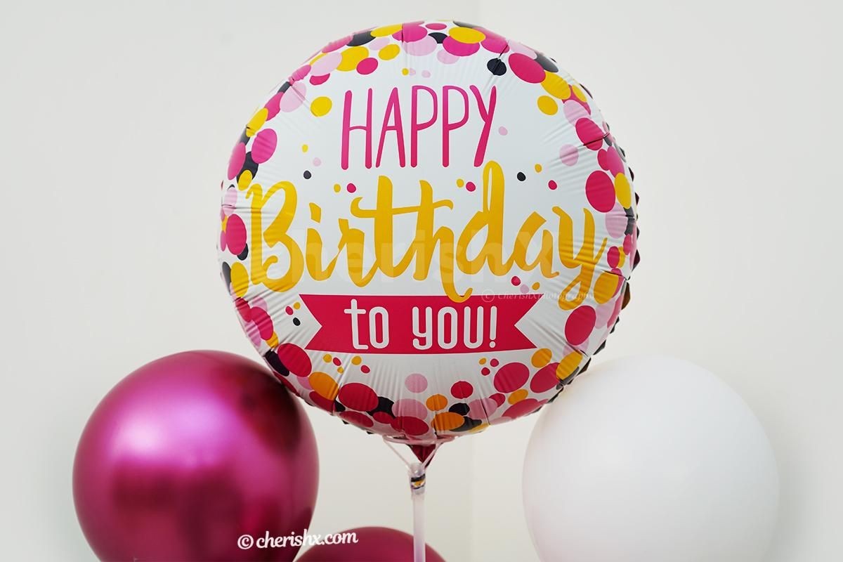 A whole bunch of pink shade balloons are mixed to present to you this pretty birthday balloon stand.