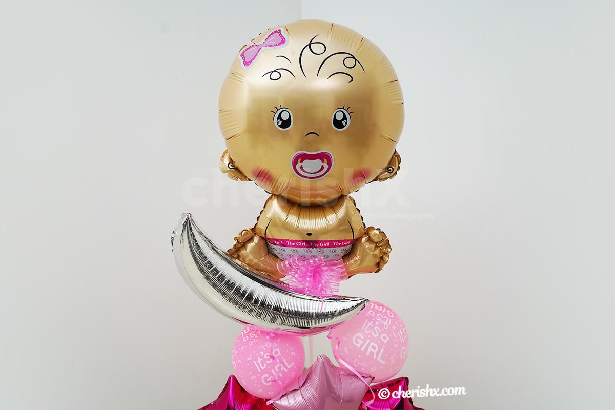 A Baby Girl Face Foil Balloon.