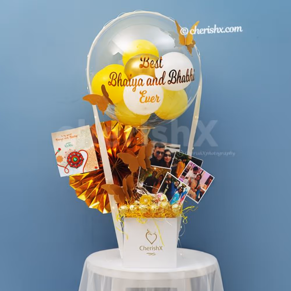 A Bubble balloon filled with yellow, pastel yellow, white latex and golden chrome balloons with a Golden Butterfly on it.