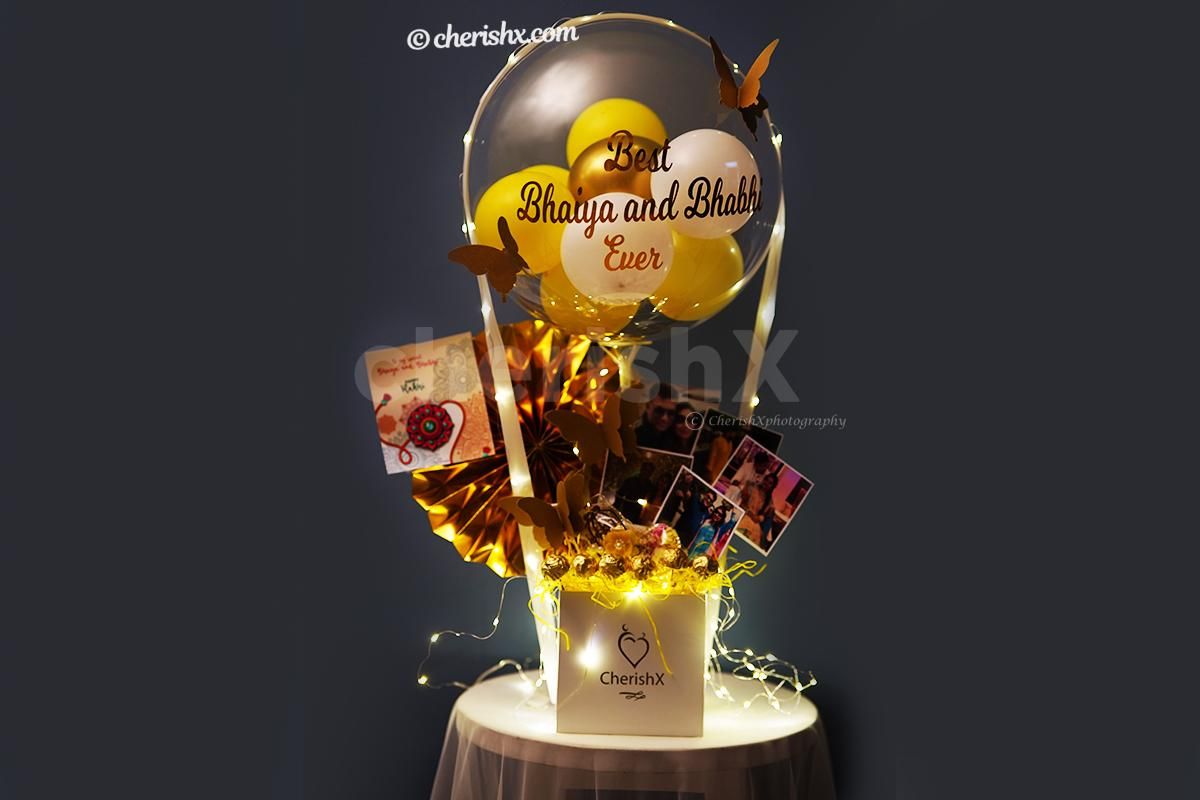 A beautiful Yellow & Golden Raksha Bandhan Gift for your bhaiya bhabhi.