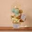 A wonderful bucket filled with balloons to gift to your sister on Rakhi!