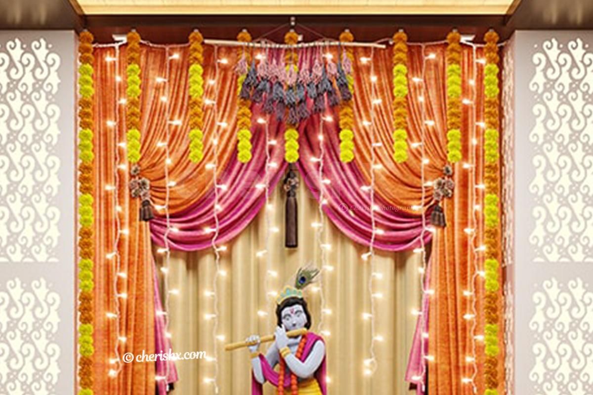 Artificial Marigold Flower String hanged on the wall.