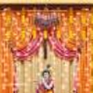 Artificial Marigold Flower String hanged on the wall.