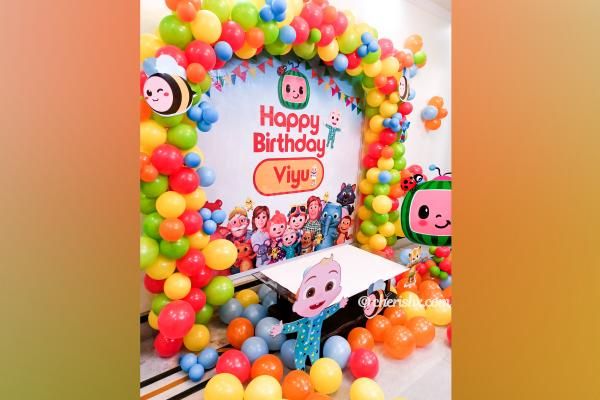 2. CherishX's Cocomelon Themed Kid's Birthday Decor includes colourful balloons and themed cut-outs