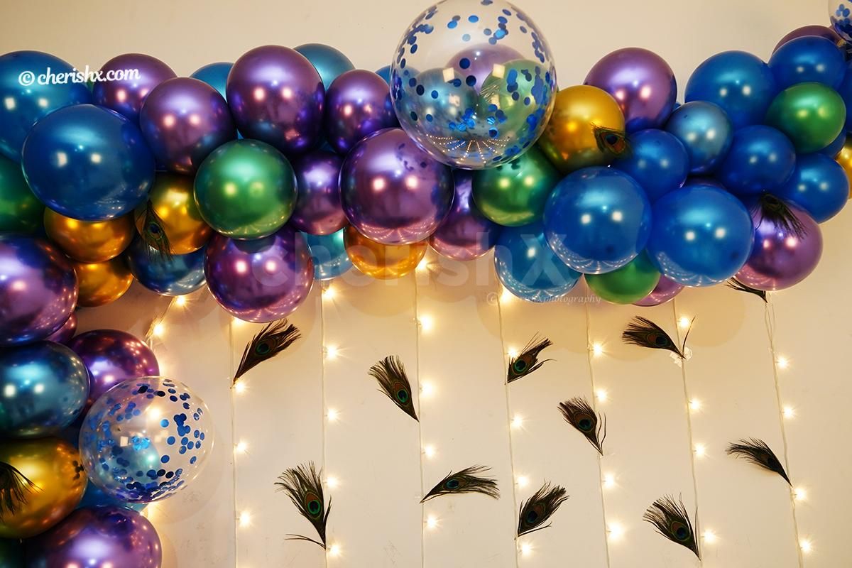 Murti of Ganesha placed at the center of the Peacock Themed Balloon Decor for Ganesh Chaturthi!