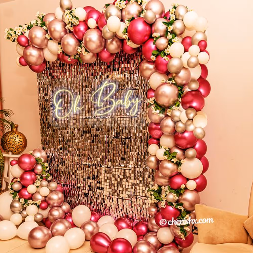 A Baby shower decoration with sequins wall and neon signage by CherishX