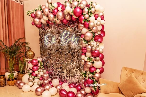 A Baby shower decoration with sequins wall and neon signage by CherishX