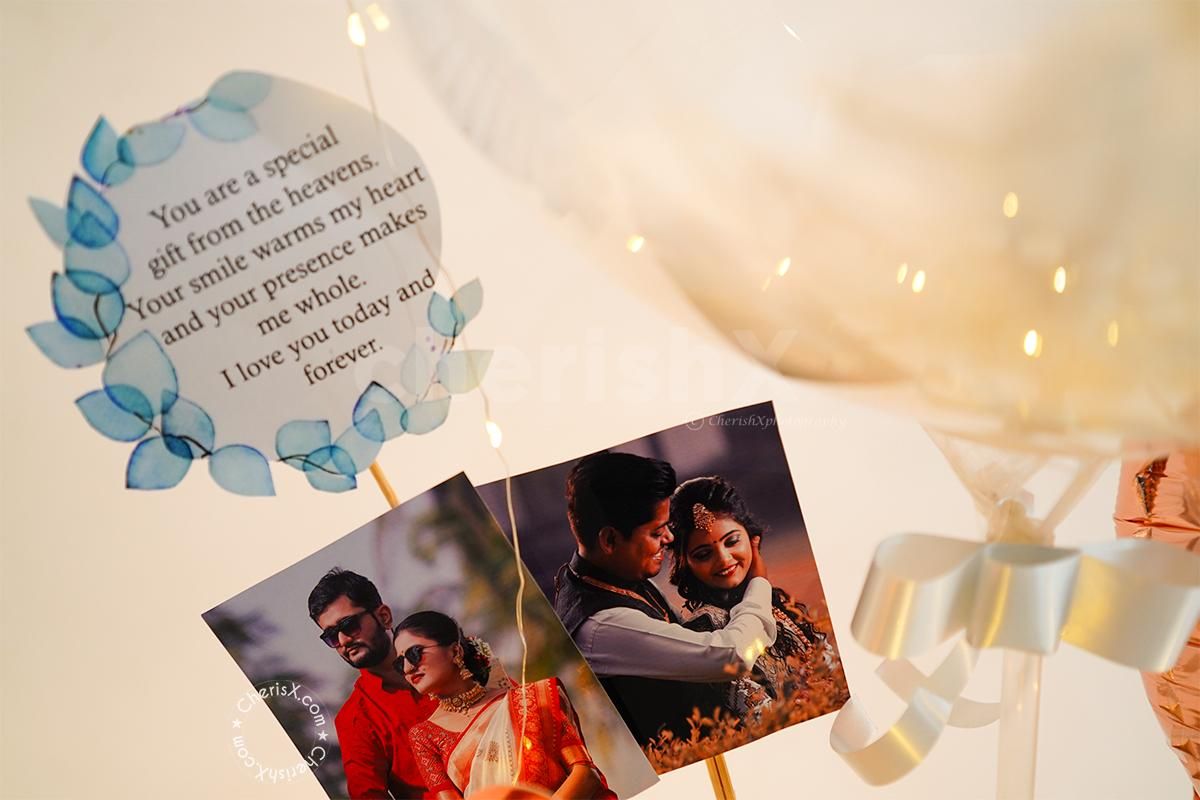 Pretty Bubble Balloon Bucket filled with Feathers for Karwa Chauth.